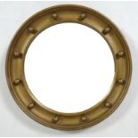 A 19th century gilded porthole mirror with bevelled glass and bead detailing, 40 by 4cm.