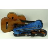 A Tatra three quarter size violin, 19 by 55cm, together with an Encore acoustic guitar, 37 by 100.