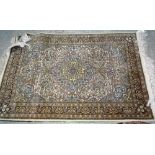 A modern rug of central Persian design, 123cm x 185cm with a modern Indian green bokhara rug,