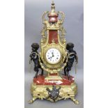 A modern Italian gilt brass, bronze and marble clock garniture with three matching candelabra,