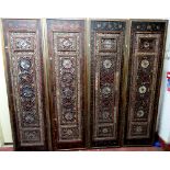 A set of four Qajar panels, each with floral painted decoration and inset glass mosaic,