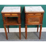 A pair of early 20th century French caved walnut bedside tables,