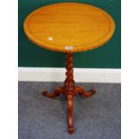 A Victorian satinwood circular tripod table, on barleytwist column and three downswept supports,