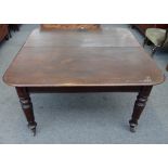 A William IV mahogany extending dining table, on lappet carved supports, lacking extra leaves,