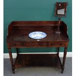 An early 19th century mahogany washstand, with galleried back and inset ceramic wash bowl,