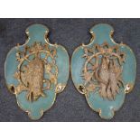 A pair of 19th century gilt and later painted carved wood wall appliques probably German,