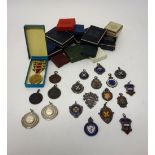 Ten silver and enamelled fob medallions and four further silver fob medallions,