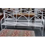 A Regency style white painted wrought iron triple hump back garden bench, 181cm wide x 101cm high,