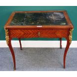 An 18th century French gilt metal mounted mahogany writing table with leather inset top over single