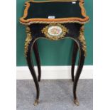 A 19th century French gilt metal mounted ebonised and amboyna banded jardiniere stand,