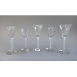 Two opaque twist wine glasses, 20th century, each with flared bowl,