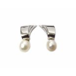 A pair of white gold, diamond and cultured pearl earclips, each of geometric design,