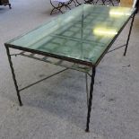 A suite of 20th century iron garden furniture, to comprise; a glass top rectangular table,