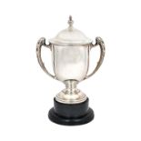 A silver twin handled large trophy cup and cover, the handles with foliate decoration,