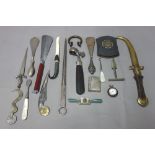 A quantity of small collectables including; a 19th century quill cutter, a ham bone clamp,
