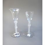 Two opaque twist wine glasses, circa 1760, the first with trumpet bowl and double knopped stem,