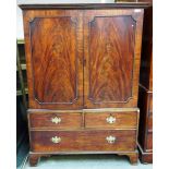A mid 18th century mahogany linen press, the pair of panel doors over two short and one long drawer,