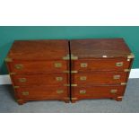 A pair of brass bound teak campaign style three drawer bedside tables,