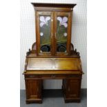 A late 19th century oak bureau cabinet,