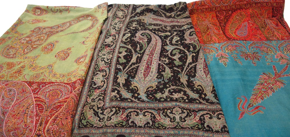A late 19th century paisley square table cover with a turquoise main field within a boteh border