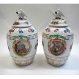 A pair of Berlin porcelain ovoid fluted vases and covers, late 19th/early 20th century,