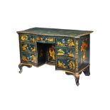 A late 19th century green lacquer chinoiserie decorated kneehole writing desk,