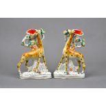 A rare pair of Staffordshire pottery spill vases, mid 19th century,