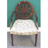A 19th century mahogany carver chair, with floral carved wheel back on channelled square supports,