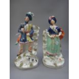 A pair of Staffordshire pottery figures of Highlanders, mid 19th century,