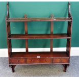 A set of 19th century Gothic Revival mahogany hanging three tier wall shelves with three lower