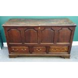 A large 18th century oak mule chest with four arch panel front over three drawers on bracket feet,