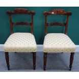 A pair of early 19th century faux rosewood side chairs, with carved crest and waist rail,