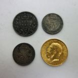A George V half sovereign, 1914, a Victoria Jubilee head sixpence,