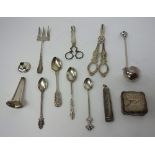Silver, comprising; a pair of scissor action sugar nips, circa 1800, a small toddy ladle,