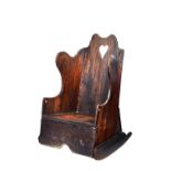 A 19th century oak diminutive lambing chair, on rocking base, 39cm wide x 60cm high.