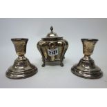 Silver, comprising; a hinge lidded tea caddy, of bombe shaped form,