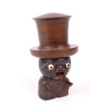 A carved wooden Japanese Kobi toy/dice holder/shaker, in the form of a gentleman wearing a top hat,