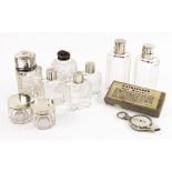 A set of seven silver mounted glass dressing table jars and bottles, Asprey, London 1951,