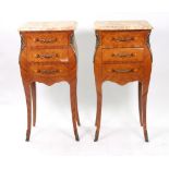 A pair of reproduction Louis XV style kingwood and floral marquetry petit bombe commode,