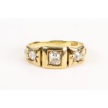 A late Victorian gold and diamond three stone gypsy ring,