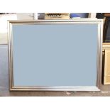 A large modern rectangular bevel edge wall mirror, by John Lewis, in moulded silvered wood frame,