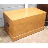 A teak rectangular chest, 20th century, the hinged cover enclosing a lift-out tray,