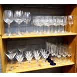 A large collection of plain drinking glasses, in four graduated sizes (qty).