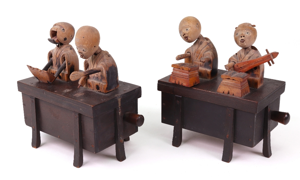 Two carved wooden Japanese Kobi toys, both with two figures on top of a box, - Image 2 of 2