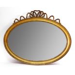 A George III style oval moulded giltwood and gesso frame wall mirror, late 19th century,
