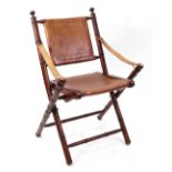 A reproduction mahogany and leather upholstered folding campaign chair,