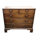 A George III mahogany chest, the moulded rectangular top above two short and three long drawers,