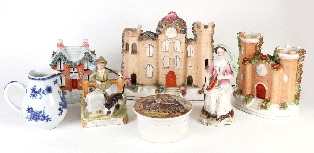 Two Victorian Staffordshire frit decorated castle spill holders, each with a clock face,