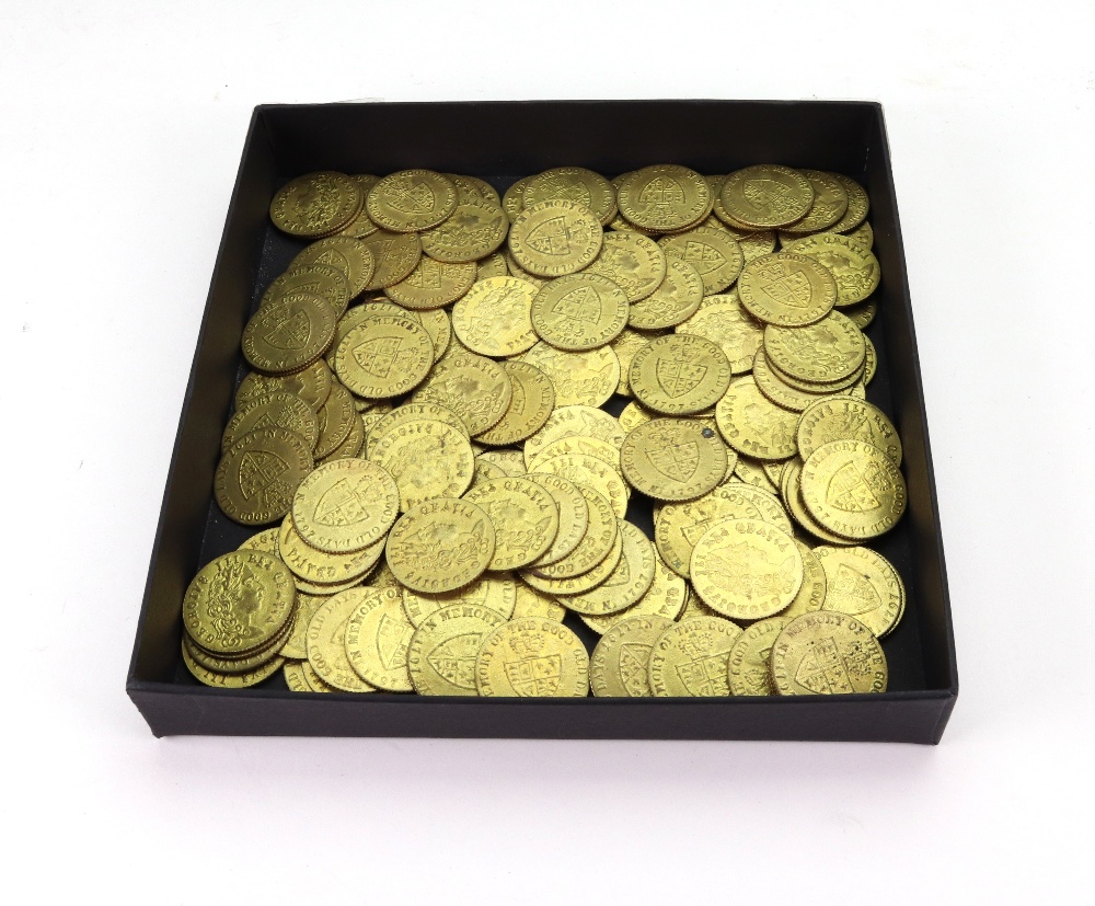 A collection of 150 replica George III guinea gilt metal gaming counters, 19th century.