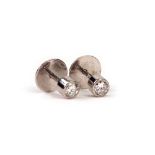 A pair of white gold and diamond single-stone ear studs, collet set brilliant cut stones approx. 0.